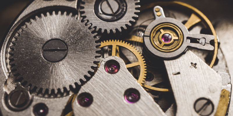 Close-up of interlocking gears and jewels inside a mechanical watch movement