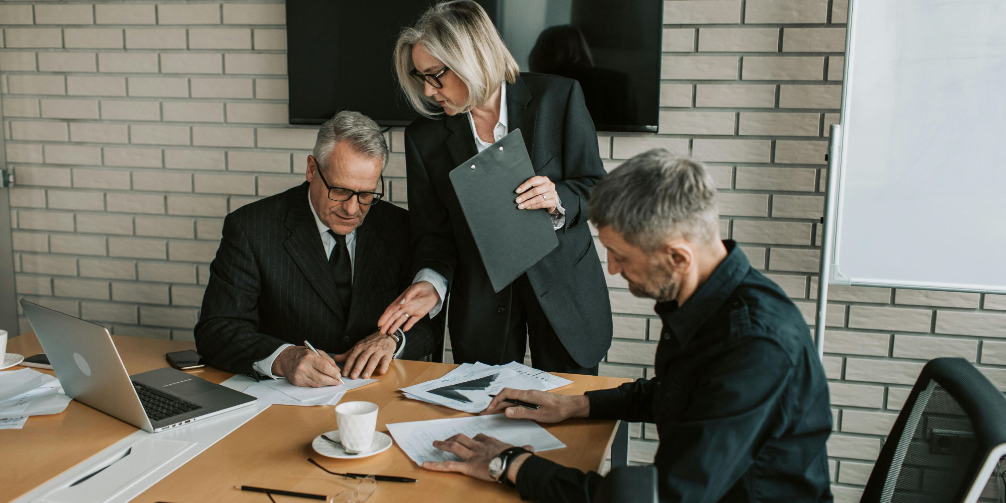 A board reviewing and signing the authorization behind a share issuance